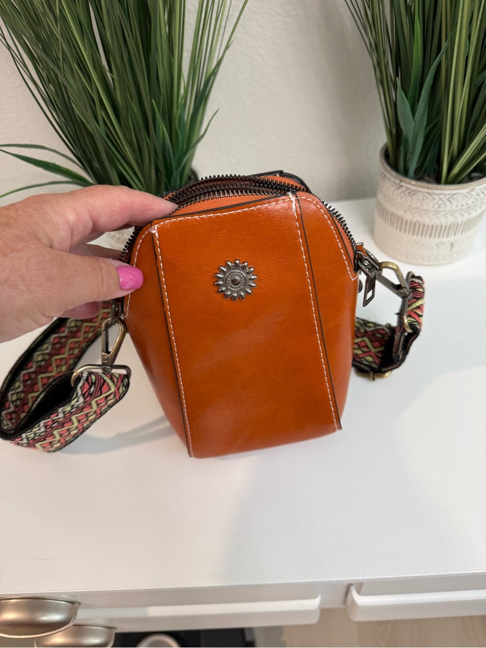 Women's Orange Leather Crossbody Bag with Decorative Accent